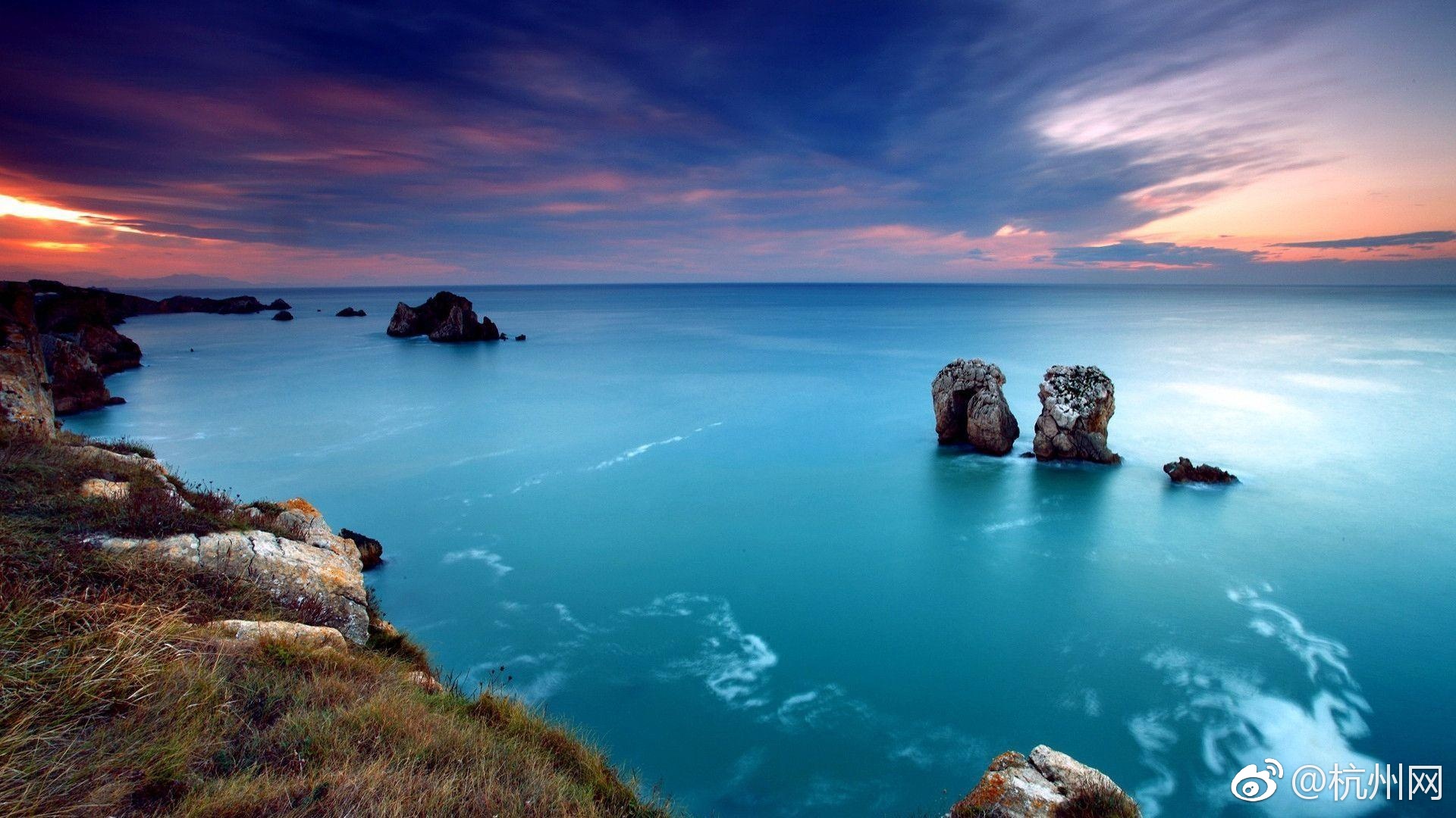 A museum displayed ancient Greek artifacts including statues vases and coins